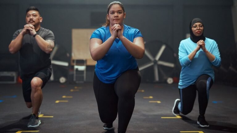 Three people performing lunges