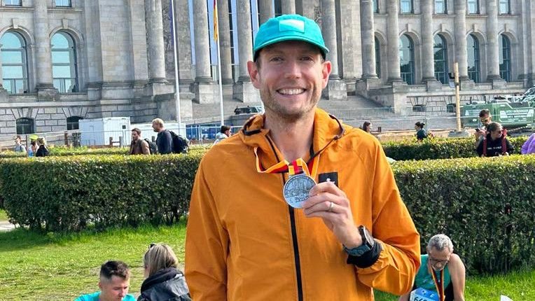 Nick Harris-Fry holding a Berlin Marathon finisher&rsquo;s medal