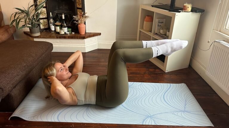 The author performs the crunch and knee raise