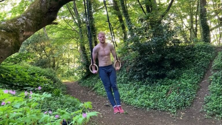 Harry Bullmore using gym rings in a forest