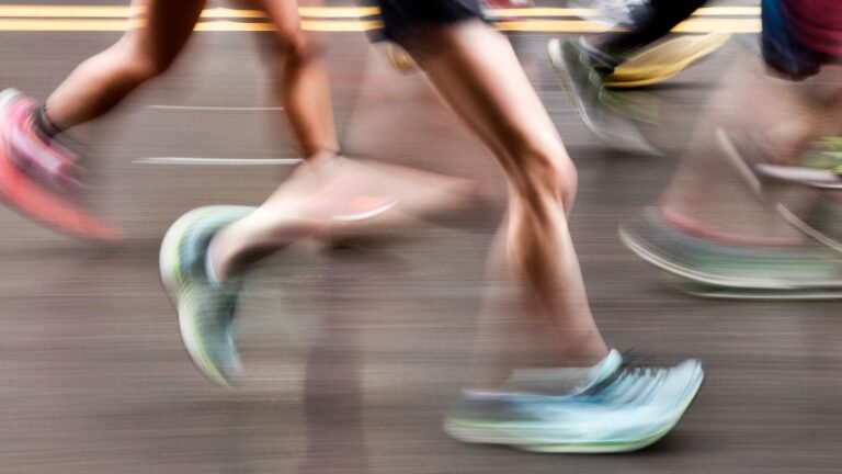 Feet of runners, photographed with motion blur