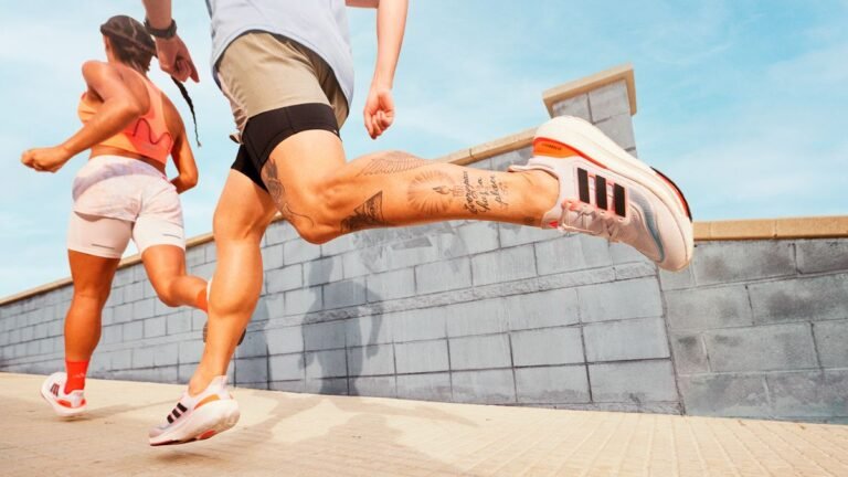 Man and woman running in Adidas UltraBoost Light